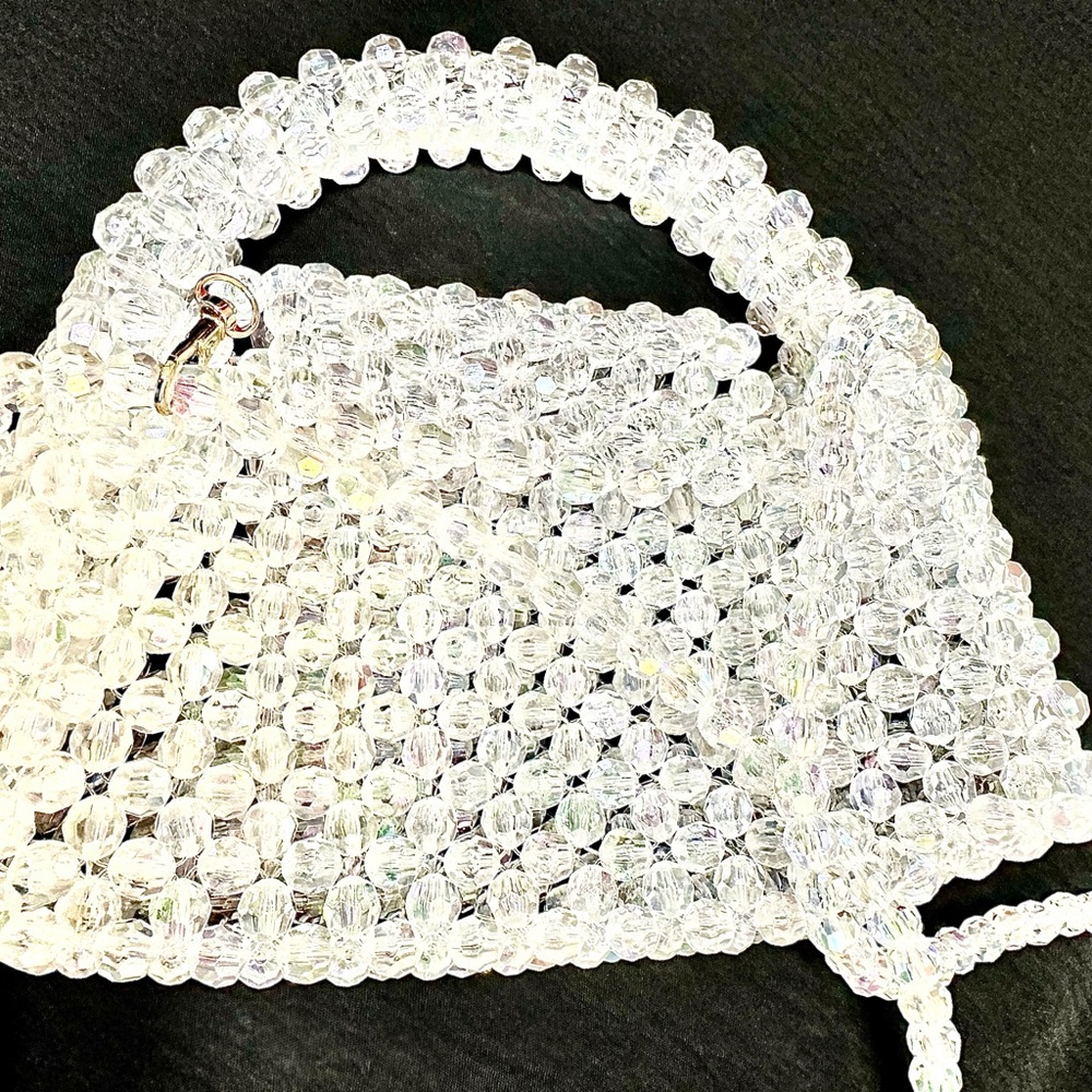 Sparkling clear beaded handbag with a chic structured shape.